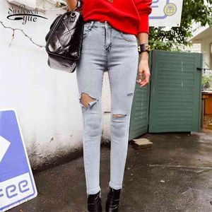 Moda Delik Yırtık Kot Sonbahar Yüksek Bel Kadın Vintage Sıska Mavi Pamuk Kore Slim Serin Denim Pantolon 10416 210510