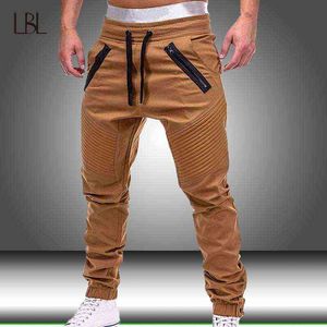 Mężczyźni Spodnie Cargo Joggers Ołówkowe spodnie dresowe Slim Fit Casual Mężczyzna Sportswear Solidne Spodnie Multi-Pocket Nowe Hip Hop Harem Spodnie H1223