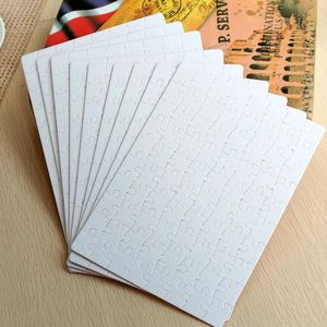 Sublimação Puzzle A5 Tamanho DIY Produtos Sublimações Blanks Blanks Quebra-cabeças Branco Jigsaw 80 Pcs Tal Heat Printing Transferência Handmade Gift Wll-YFA2694