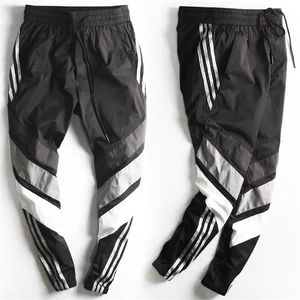 Primavera verão calças esportes homens ferramentas ferramentas macho feixe pés masculino versão juventude fechando pés nove pontos calça casual pant 211201