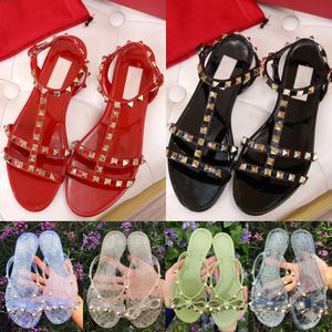 MARCA chinelos femininos verão moda chinelos geleia luxo sandálias casuais fundo plano laço rebites sapatos de praia menina senhora designer doces cor preto vermelho