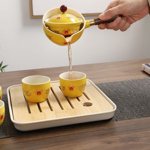 노란색 중국어 드래곤 디자이너 여행 차 세트 독특한 그림 고품질 회전 찻잔 kungfu teaset creamic 선물 친구