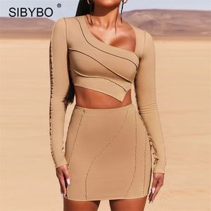 Sibybo Completo casual a righe bianche Completo a due pezzi Crop Top e gonne aderenti Completo da donna Primavera Streetwear Set coordinati 210714