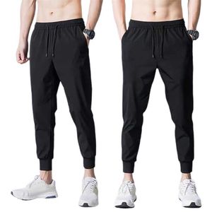 Andningsbara män Mesh Jogging Byxor Koreansk version Man Svart Sport Casual Byxor Y0811