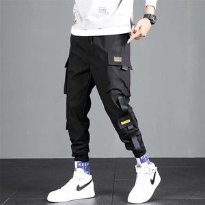 Harajuku fitas harem corredores homens calças de carga moda cordão calças calças streetwear quadril hop casual bolsos pista de pista 211201
