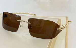 Occhiali da sole senza montatura Lenti marroni dorate Gafas de sol Occhiali da sole alla moda da uomo Occhiali con protezione UV400 con scatola