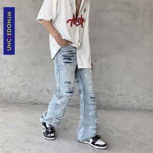 UNCLEDONJM High Street jeans strappati hip hop pantaloni svasati a pieghe per uomo kpop vestiti denim E083 211111