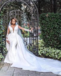 2022 Abiti da sposa a sirena africana di lusso Scollo a V maniche lunghe Illusion Pieno di applicazioni in pizzo Overskirts Treno staccabile Bottone Indietro Abiti da sposa Taglie forti