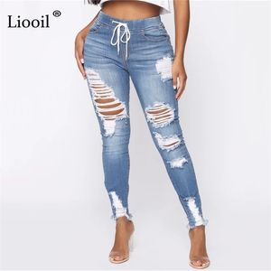 Светло-синие джинсы для женщин для женщин-стрит стиль сексуальный серединный подъем огорченный брюк стремятся тощая дыра джинсовые карандашные брюки 210809