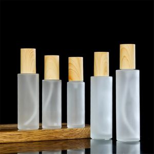 Frosted Glass Bottle Face Cream Jar Lotion Spray Pump Bottles Refillable Cosmetic Container 20ml 30ml 40ml 50ml 60ml 80ml 100ml 120ml with Imitated Plastic Wood Lid