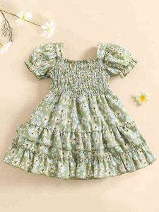 赤ちゃんの平凡な花のプリントシールリュドゥフスリーブ層状裾ドレス