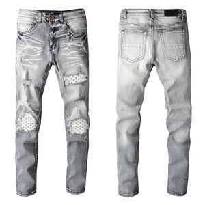 Jeans da uomo Designer Fori per l'industria pesante Pantaloni strappati a righe blu Stile vintage Foro Moda Uomo Jean Slim Pantaloni da motociclista da motociclista W28-W40