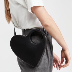 Europese en Amerikaanse seks hartvormige koppeling mode tassen holle handvat een schouder messenger bag