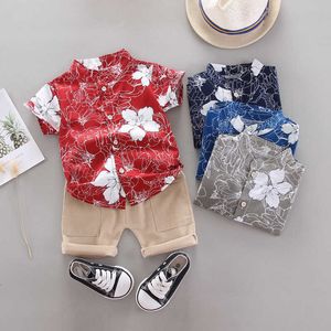 Childrens de mangas curtas terno verão novo bebê meninos moda flor impressa cardigan + cor sólida calças de carga 2 pcs conjunto 1-4 anos x0802