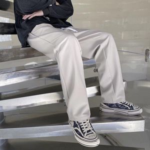 As calças dos homens Men Branco Blazers 2022 Primavera-Verão Streetwear sólidos a granel retas largas pernas Baggy Trousers Casual