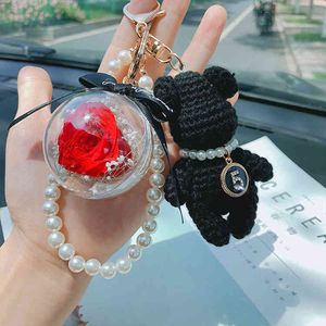 Japan und Südkorea Gestrickte kleine Bärenschlüsselkette personalisierte Fadenhaken Perle Rose Unsterbliche Blumentack Anhänger Nette Puppe