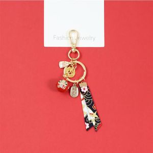 Keychains Cute Japanese Daruma Bell Keychain Pray Luck Wealth Tassel Pendant Keyring Car Key Holder Womens Bag Backpack Kids Gifts