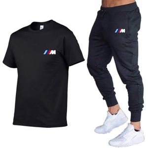 Designer 2021Novo Conjunto de Agasalho Masculino de Duas Peças Mangas Curtas e Calças com Letras Listradas Estilo da Moda Primavera Verão Outwear Conjunto Esportivo Camiseta Terno