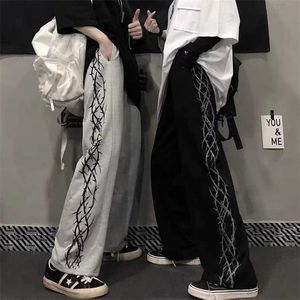 Houzhou byxor kvinnor tryckta lösa unisex par byxor hajuku streetwear hip hop vintage koreanska mode bredben 211115
