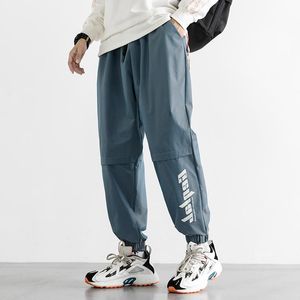 Męskie spodnie Streetwear Sweatpant Mężczyźni Harem Hip Hop Joggers List Reflective Baggy Loose Spodnie Mężczyzna Młodzież Dorywczo Moda 2022