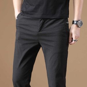 2020 Nowy Jesień Męskie Slim Stretch Casual Spodnie Biznes Moda Solid Color Stretch Spodnie Mężczyzna Brand Black Navy Blue Grey Y0811