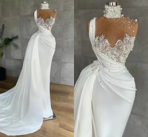 2022 Sexy Mermaid Evening Dresses Wear Luxurious Pearls Beaded High Neck Illusion Top Formal Prom Party Gowns Lace Appliques Peplum Ruched Robe de mariée