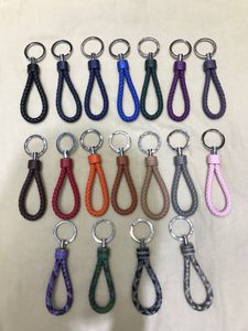 Utmärkt kvalitet grossist italien äkta läder nyckel plånböcker hållare mode nycklar ringar med vävda band Många färger marknadsföring gåva