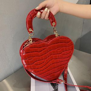 أكياس مسائية الأزياء الكتف العصرية الفاخرة حقيبة crossbody الإناث بسيط بلون أعلى حقيبة يد جلدية على شكل قلب حمل الهاتف