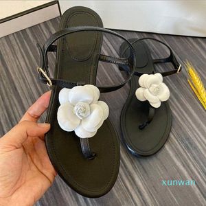 Sandálias para mulheres 2019 novo estilo de fadas plana camélia real couro pé verão pequeno tamanho 32