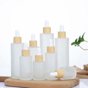 Frostat glas droppflaska Essentiell oljepfym Kosmetisk packning Flaskor behållare med imiterat trä lock 20 ml 50 ml 60ml 100ml