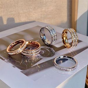 2021 Anel de Casamento Mais Vendido Sparklinng Jóias de Luxo Aço Inoxidável de Alta Qualidade com Preenchimento de Ouro Rosa Festa de Cristal Feminino Masculino Banda de Noivado Anéis para Presente dos Amantes