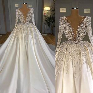 White Satin Ball Gown Wedding Dress with Beaded Crystal Pearls and Long Sleeves