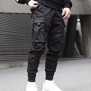Automne hommes rubans couleur unie noir avec poche Cargo pantalon 2021 Harem Joggers mâle Harajuku survêtement Hip Hop pantalon hommes