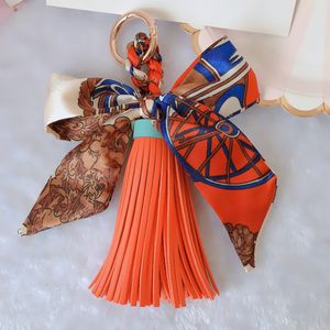 Ribbon Bow Women Nyckelringar Scarf Bowknot PU Läder Tassel Bilnyckel Kedja Ringhållare Mode Hängsmycke Smycken Keyring Charms Bag Tillbehör för Girls Present