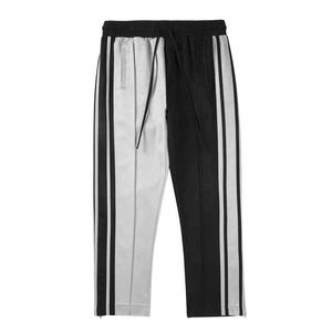 Calças masculinas High Street não é a mesma listra de contraste de cor costurada deerskin veludo yin yang esportes elásticos cintura casual pants de pernas largas