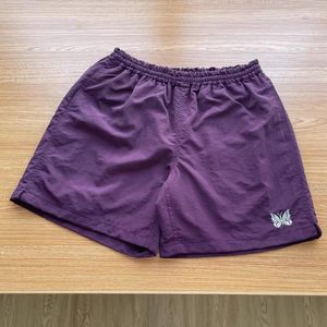 Herrbyxor sommar män kvinnor kvalitet broderi fjäril nålar spår shorts awge byxor 2022ss elastiska midja shortsmens shorts 660