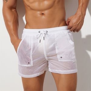 Verão Mens Shorts Sexy Semi-transparente Nylon Quick Seco Academias Casuais Casas Desgaste Homens Bottoms 220318