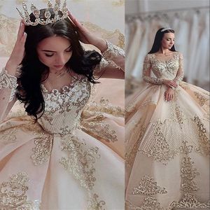2022 Sexy Luxury Champagne Quinceanera Ball Gown Dresses Jewel Neck Illusion Lace Appliques Crystal Beads Long Sleeves Sweep Train Tiered Plus Size Party Prom Gowns