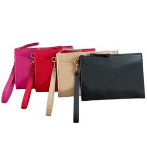 Clutch Bag Womens Wristlet Bags Fashion Accessoires Nyckelpåse Designer Dragkunnig myntväska handväska utomhuskopplingar plånbok