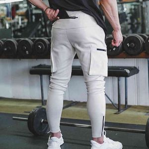Multi-kieszeni joggery spodnie dresowe spodnie na tory Męscy siłowni trening fitness Spodni Sprężyna męska swoboda chudy