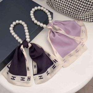 2022 Pearl Ribbon Letter Hair Accessories Luxury Designer Silk Bracelet Vintage Purple Satin Elastic Hair Band Designer Headband AA220323
