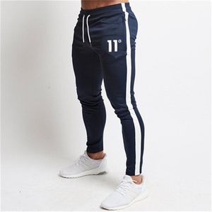 Solid Casual Mens Casual Slim Fit Tracksuit Sports Solid Male Gym algodão Skinny Joggers Sation calça calça 220524