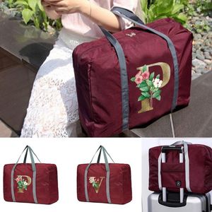 Duffel Bags Nylon fällbar resa unisex stor kapacitet bagagepåse kvinnor handväskor män gyllene blommebrev serieduffel