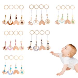 4 PcsSet Baby Play Gym Frame Stroller Hanging Pendants Wooden Ring Teether Molar Teething Nursing Rattle Toys Gifts Infant Room 220531