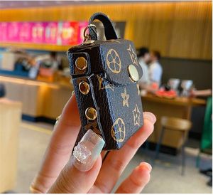 Modedesigner Airpods Case Keychains Trinkets Pu Leather Nyckelringar Kedjor smycken Brown Flower Pendant Bag Charms Keyrings Car Keys Holder Fashion Accessories