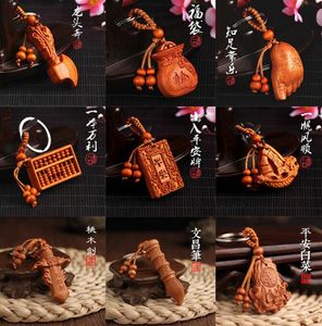 Mode mahogny nyckelkedja snidad ping ett kort mycket lukrativt svärd fu väska 12 stil bilnyckel hänge gåva