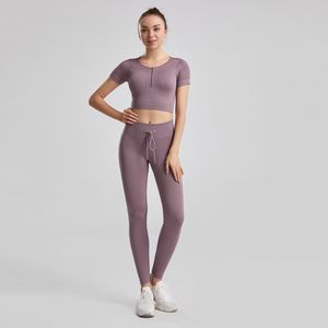 Womens yoga out fit High Waist Running thread strong stretch solid color nylon Fitness short sleeve and pocket pants suits seamless hip-lifting Leggings tracksuits