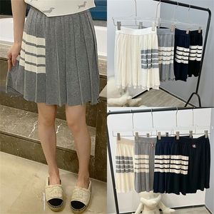 85 off online sale women s new summer college style knitted high waist slim pleated front and long in back short skirt fashion