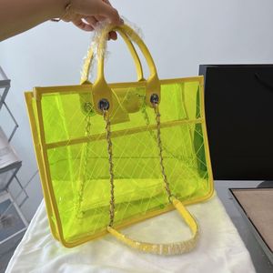 Прозрачный дизайнер мешков желе Luxury 5a Высококачественные качественные однорубежные пляжные сумки для пляжа Летняя лимитированная серия женская банкетная сумка для подмышки монеты 38см 30 см.