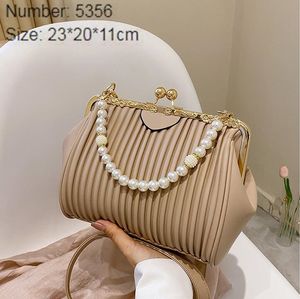 Wholesale leathers shoulder bags sweet little fresh pearl shell bag in summer This year's popular embossed leather handbag Joker simple striped handbags 5356